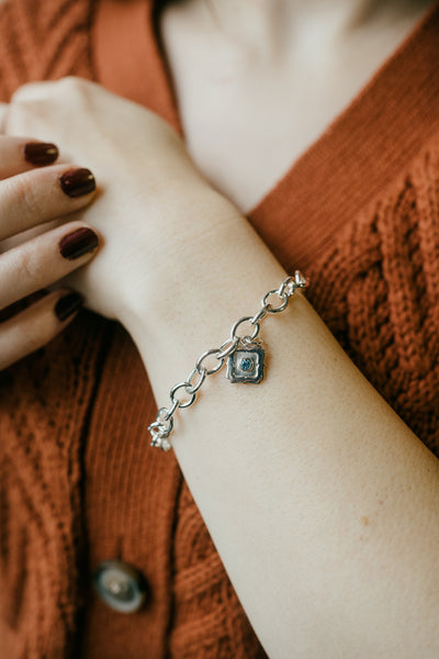 Sterling Silver Charm With Silver Bracelet (Available in Blue Topaz Gemstone Only) )